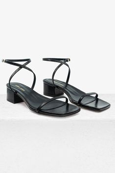 Made of woven nappa leather, this Brenda sandal has a thong silhouette with a 40mm block heel and square toe. Heel Height: 40mm Made in Spain True to size Cute Black Sandals Flats, Homecoming Heels, Luxury Tote Bags, Black Sandals Flat, Work Fits, Shoes Hack, Elegant Sandals, Black Strappy Sandals, Travel Outfits