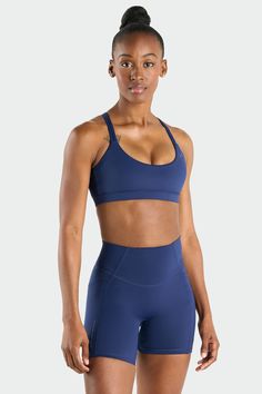 The Hyper-Power Strappy Sports Bra is ultimate for conquering any fitness challenge, whether it's a gym session or a morning run. This women’s workout sports bra features a high-support fit that contours to your body with a strappy back design. Our fabric is sleek and cooling, ensuring you stay comfortable even during your most intense workouts. The ultra-soft hand feel adds an extra layer of luxury to your routine, while the fabric's sweat-wicking properties keep you dry and focused. Athleisure Nylon Sports Bra For Sports Events, Functional Athletic Fit Sports Bra For Gym, Functional Athletic Fit Sports Bra For Training, Nylon Squat Proof Sports Bra In Athleisure Style, Athletic Fit Sports Bra For Running, Sports Bra With Medium Support For Sports, Squat Proof Racerback Sports Bra For Athleisure, Medium Support Sports Bra For Training, Squat Proof Racerback Sports Bra