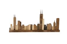 a wooden sculpture of a city with tall buildings on it's sides and spires