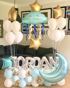 balloons are floating in the air near a sign that reads,'jordan'and stars