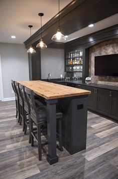 a large kitchen with an island in the middle