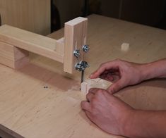 a person is working on a piece of wood