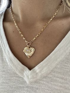 "Make a statement with our heart and evil eye charm necklace, looks beautiful on its own or layered with more necklaces. Personalize your necklace by adding more charms.  As seen in photo with our Bubble Cross Necklace.  Charms: 16k gold plated Chain: 16k gold plated rectangle link chain  17\" length + 2\" extender chain, rectangle link chain. If you have any questions, please message me." Spiritual Heart Necklace With Vintage Charm, Gold Heart Necklace With Chunky Chain For Gift, Gold Chunky Heart Necklace, Gold Plated Evil Eye Charm Necklace Gift, Chunky Heart-shaped Gold Necklace, Spiritual Heart-shaped Necklace With Vintage Charm, Spiritual Heart-shaped Vintage Charm Necklace, Gold Chunky Necklace, Heart Evil Eye