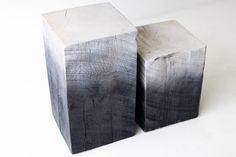 two black and white wooden blocks sitting side by side