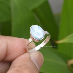 Description : Larimar Ring, Sterling Silver Ring, Natural Larimar 7x10mm Oval Shape Gemstone Ring, Handmade Ring, Christmas Gift, Gemstone Ring, Size 6 US ---------------------------------------------------------------------------------------------------------------------------------------------------- Material : Solid 925 Sterling Silver & Gemstone Metal: Solid 925 Sterling Silver Stone Detail : Natural Larimar Ring Size- 6 US Size : 7x10 mm Shape- Fancy Cabochon Weight- 2.75 Grams Approx - White Larimar Round Jewelry, Oval Larimar Rings For Anniversary, Oval Larimar Jewelry For Anniversary, Oval Larimar Gemstone Rings, Oval Larimar Cabochon Rings, Oval Moonstone Larimar Ring, Oval Shape Ring, Larimar Ring, Larimar Rings