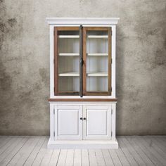 a white cabinet with two glass doors and shelves