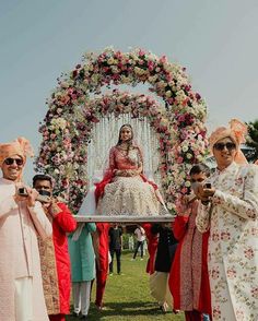 the bride and groom are taking pictures with their cell phones