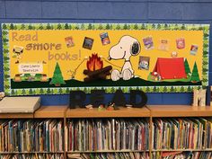 there is a sign that says read more books on the wall next to some bookshelves