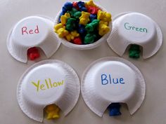 four paper plates with different colored gummy bears in them and the words yellow, red, green, blue