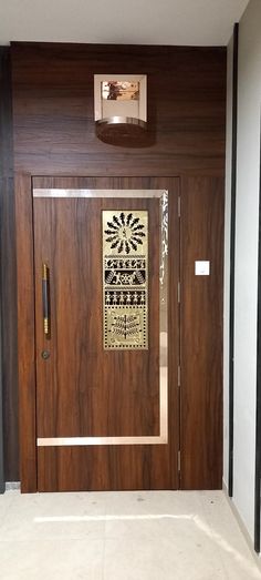 a wooden door with decorative artwork on it