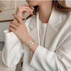 Description: Inlaid Natural Pearl Shell Chic CZ Heart Bracelet Specification:Size: 26 cmWeight: 15.6 g/pcsMaterial: 24k gold, copper, cubic zirconia, natural pearl shellColors: gold Add a touch of ocean chic to your style with our Inlaid Natural Pearl Shell Bracelet. The 24k gold CZ heart charm adds a romantic touch to this unique piece. Perfect for any occasion! 🌊💕✨ Winter Bracelet, Shell Heart, Shell Bracelet, Enamel Bracelet, Delicate Design, Real Pearls, Gold Copper, Natural Pearl, Pearl Shell