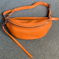 Rebecca Minkoff Bree Mini Belt Bag In Monarch (Orange) Model Photos Are For Size Reference. Please See Photos For Measurements. Orange Color Is Hard To Describe, But It Photographs A Lot Brighter Than Real Life; The Orange Zipper Fabric Is Brighter Than The Duller/Dingier Orange Leather In Person (Photo #8). Floor Photos Were Taken By A Window With Natural Sunlight. Photo #7 Was Taken Outdoors. Photo #8 Was Taken With Indoor Lighting. Used Once Very Briefly For A Baseball Game Years Ago. Selling Bc Haven’t Used It Since. Still Has Tags Inside; Strap Hasn’t Straightened Out Yet. Please Be Aware That The Black Fabric Lining Attracts Lint And Dust. Great For Repping Sports Teams That Ha Modern Orange Crossbody Shoulder Bag, Orange Bag With Zipper Pocket For Daily Use, Orange Pouch Bag For On-the-go, Orange Leather Shoulder Bag With Zipper Closure, Orange Soft Leather Crossbody Shoulder Bag, Luxury Orange Pouch Shoulder Bag, Orange Soft Leather Shoulder Bag For Travel, Orange Shoulder Bag With Zipper Pocket For Daily Use, Orange Zipper Closure Crossbody Shoulder Bag