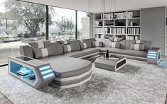 a modern living room with grey and blue furniture