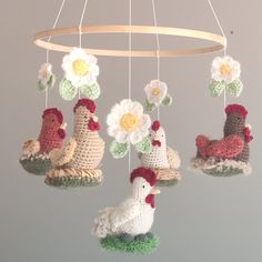 This handmade chicken mobile features colorful designs with white daisy flowers, perfect for adding a touch of whimsy to any nursery or baby room. The mobile is ready to ship and is sure to brighten up any space. The brand is handmade, and the color is white, making it a unique addition to any collection. It is ideal for babies and young children and will make a great gift for a newborn. This nursery mobile perks interests in babies and toddlers. Creates a beautiful and entertaining environment for babies and toddlers. This nursery mobile offers you its best quality, looks great, and feels great due to its soft material. Things to know - The hanger of this mobile is 12". - Prepared to be hung (loop at top) but does not provide a hook. - No chemical wool. Chicken Nursery, Chicken Nursery Theme, Farm Themed Nursery, Farm Animals Nursery Theme, Barnyard Nursery, Farm Nursery Theme, Farm Animal Nursery, Baby Nursery Neutral, Farm Nursery