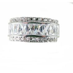 a white gold ring with three rows of baguettes and diamonds on the sides