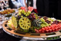 a platter filled with lots of different types of fruit