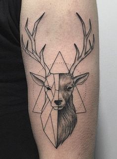 a tattoo on the arm of a person with a deer's head and triangles