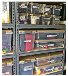 the shelves are filled with plastic containers and bins for various types of things to put in them