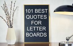 a sign that says 101 best quotes for letter boards next to a lamp on a desk