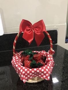 a basket filled with strawberries sitting on top of a counter