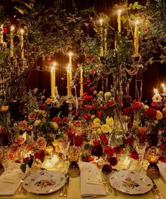 the table is set with flowers and candles for an elegant dinner party or special event