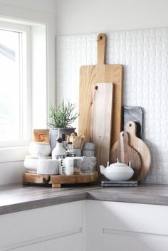 kitchen counter with cutting boards and utensils on it