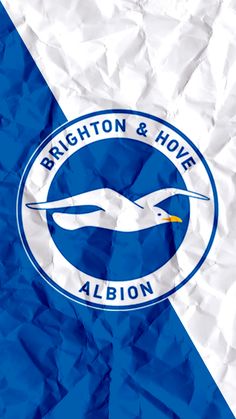 the brighton & hover logo on crumpled paper with blue and white diagonal stripes behind it