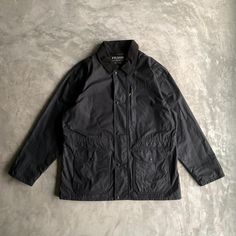 FILSON Weekender Cover Cloth Coat (washed) - USA 2016 - Size L (look on measurements) - Condition: need wash and rewax, there is no zipper tab for the lining (photo incl.) Measurements : cm/in * chest 65/25.59 * length 79/31.1 * shoulders 53/20,87 * sleeve length 67/26,38 * hem 66/25.98 Questions? fill free to ask * no refund !IMPORTANT! information about delivery: fill free to ask about express delivery before order  * Please note that all clothes which I sell are vintage or used and may have s Urban Washed Outerwear For Work, Classic Washed Black Outerwear For Work, Classic Black Washed Outerwear, Rugged Dark Wash Cotton Outerwear, Military Style Cotton Outerwear For Hunting, Stonewashed Dark-wash Cotton Outerwear, Dark Wash Single-breasted Cotton Outerwear, Military Black Outerwear For Hunting, Cloth Coat