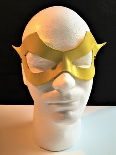 DESCRIPTIONSpeed around town in a yellow mask for supervillian Professor Zoom, Reverse Flash! Great for Halloween or Marvel Firestar at Comicon. **We also sell this mask with a red lightning bolt!** Or, perhaps you need a plain yellow mask for Masquerade Ball. Get this style in any color. Waterproofed leather, glossy or matte finish, & several choices to affix the mask (cord, elastic, ribbon, waterproof cord, stick, or no holes for adhesive). Measurements: 3.25" high x 10.5" wide (tallest &a Superhero Masks For Cosplay Events, Yellow Costume Accessories For Halloween Cosplay, Yellow Halloween Cosplay Costume Accessories, Superhero Mask For Cosplay, Comic-con Costume Party Mask, Superhero Masks For Halloween Masquerade, Superhero Style Masquerade Masks For Halloween, Superhero Masquerade Mask, Marvel Firestar