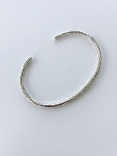 A set of three cuff bracelets, one round, two flat, one of them a bit thinner than the other. These are available in sterling silver or brass. Hammered Cuff Bracelet, Round Two, Ring Necklace, Ring Earrings, Necklaces Bracelets, Decorative Accessories, Cuff Bracelets, Jewelry Earrings, Cuff