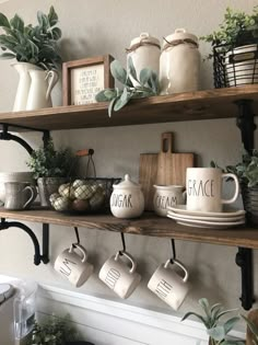 coffee mugs and other items are displayed on shelves