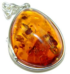 Handmade Unique 925 Sterling Silver pendant with unique one of a kind Amber,  13.20 grams of marvelous handcrafted jewelry design. Only one piece availble ready to ship! It's unique worldwide pendant - simply piece of art in world of fine jewelry. Honey Baltic Amber  .925 Sterling Silver handmade Pendant  PENDANT DETAILS: Weight: 13.20g; Material: Sterling Silver; Main stone: Amber; Dimension: L- 2 1/8, W- 1 1/4, T-  1/2 inch; Inner Bail Diameter: 1/4 inch; Stamp / Mark: 925; Condition: New; Mai Unique Silver Jewelry, Jewelry Online Store, Ruby Emerald, Jewelry Pendants, Unique Jewelry Designs, Unique Handmade Jewelry, Silver Pendants, Online Jewelry Store, Handmade Pendant