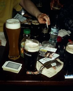 a table topped with lots of different types of beer