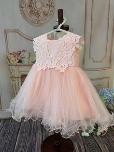 Delicate dress with high attention to detail. This design features embroidered flowers and three tulle layers for a puffy look. Dress is fully lined to ensure baby’s comfort. Works great as a flower girl dress or simply a wedding guest dress among many other special occasions.Fits true to size.Ships right away!#infant #princess #prettyinpink #comfort # baby girl #coming home outfit # first birthday dress # gift for baby # party dress # little lady #babygirlOccasion: Vintage princess gown perfect Elegant Tulle Tutu Dress With Floral Applique, Floral Embroidered Tulle Dresses For Dress-up, Floral Embroidered Tulle Dress For Dress-up Events, Tulle Dress With Floral Embroidery For Dress-up, Tulle Dress With Floral Embroidery For Dress-up Occasions, Sleeveless Floral Applique Dress For Baptism, Pink Princess Dress With Floral Embroidery For Spring, Spring Princess Dress In Pink With Floral Embroidery, Spring Pink Princess Dress With Floral Embroidery