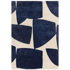 a rug with blue and white shapes on it