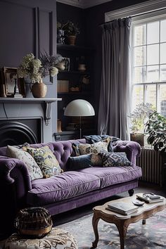 a living room filled with furniture and a fire place in front of a large window