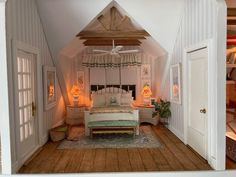 a bed sitting inside of a bedroom on top of a wooden floor next to two doors