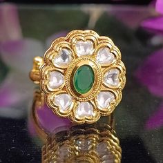 Classy and detailed Designer White Colored Kundan Gold Plated Ring. This is stylish and adjustable. This ring will work well with traditional, formal, and western formals. Eye-catching and unique jewelry that will set you apart. Gift this piece to a loved one, and see their face light up with joy. Best for gifting or for personal use, wear it to any occasion and become the spotlight. Western Formals, Beaded Ring, Emerald Bead, Face Light, Plated Ring, Gold Plated Rings, Green Emerald, Beaded Rings, Gold Design