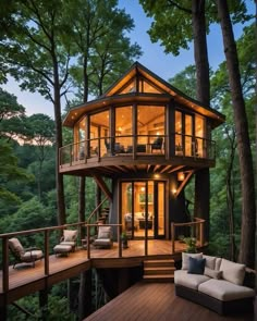 a tree house in the woods is lit up at night