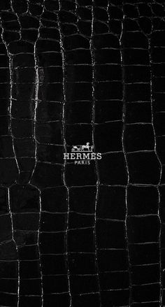 black alligator skin textured with the word hemps on it's left side