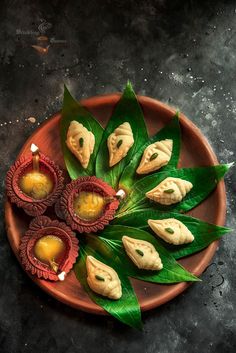 an overhead view of some food on a plate with leafy greens and sauces