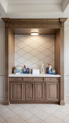 a bathroom with two sinks and wooden cabinets