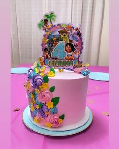 a pink birthday cake with flowers on the side and a disney princess number 4 topper