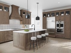 a kitchen with wooden cabinets and white counter tops, an island with stools next to it