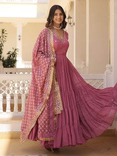 our stunning pink georgette gown, adorned with intricate embroidery and shimmering sequin work. This enchanting ensemble is designed to make you feel like a princess, radiating elegance and charm at every turn.
Available in fully stitched sizes ranging from XS to XXL, this gown ensures a perfect fit for women of all body types. With a generous 15-meter flair and a length of 56 inches, it boasts a graceful silhouette that will captivate hearts wherever you go.
Accompanying this beautiful gown is Engagement Gown, Lehenga Crop Top, Georgette Gown, Lehenga Choli Wedding, Floral Lehenga, Party Wear Lehenga Choli, Reception Gown, Bollywood Lehenga, Cocktail Wear