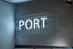 a sign that reads port on the side of a building