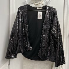 Black Sequin Blazer/Jacket With Eye Catching Iridescent Detail. Boutique Brand- Size Small But Definitely Slightly Oversized. No Pockets Or Closures (Zipper, Button, Etc.) Black Cropped Jacket For Party With Long Sleeves, Spring Outerwear With Sequins For Night Out, Black Sequined Outerwear For Party Season, Glamorous Black Spring Blazer, Black Long Sleeve Outerwear For Party Season, Black Outerwear For Party Season Night Out, Fall Evening Sequined Outerwear, Black Party Outerwear For Party Season, Black Cropped Jacket For Fall Evening