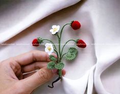 Looking for a cute and elegant addition to your jewelry collection or a sweet gift for someone special? Consider this lovely Wild Strawberry Brooch. Please note that while the shape and colors may vary slightly, the cuteness will remain  ❀. ♥ MATERIALS AND HOW IT WAS MADE: This brooch was hand-crocheted using DMC thread and a 0.5mm hook, with floral wires to create the branches. The strawberries are stuffed with polyfil and a secure safety pin is sewn onto the back. It was created in a clean, smoke-free, and animal-free environment. ♥ SIZE: Approximately 3.5 inches in length x 3 inches in width (You can see the measurement in the pictures above) ♥ ORDERING, PACKAGING - Processing time/ Turnaround time: This brooch is made to order, with a processing time of 1-2 weeks before shipping. - Pac Handmade Flower Lapel Pin For Gifts, White Flower Brooches For Gift, White Flower Brooch As A Gift, White Flower Brooch As Gift, White Flower Brooch For Gift, White Handmade Flowers Lapel Pin As Gift, White Handmade Flowers Lapel Pin For Gifts, Handmade Flower Brooches For Gifts, Handmade Flower Brooches As Gift