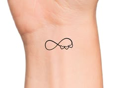 a wrist tattoo with an infinite symbol on it's left arm and the word love written in black ink