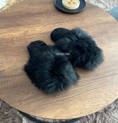 Alpaca fur slippers - alpaca slippers from Peru - unisex slippers - fur slippers - winter slippers - Gift for any occasion - fluffy fur slippers Luxurious Black Alpaca fur slippers The unisex Luxurious Alpaca fur slippers keep your feet nice and cozy even on the most blustery winter's eve. These fur slippers are very well made, ensuring they will last for years. The best part is that these slippers are made from ethically-sourced alpaca fur, ensuring the highest quality and guilt-free comfort. W Cozy Black Slippers For Indoor Use, Cozy Black Indoor Slippers, Black Faux Fur Slippers For Winter, Comfortable Black Slippers With Faux Fur Lining, Black Fluffy Slippers For Winter, Winter Faux Fur Slippers With Scuffs, Winter Faux Fur Slip-on Slippers, Cozy Black Slip-on Slippers, Cozy Faux Fur Slippers With Round Toe